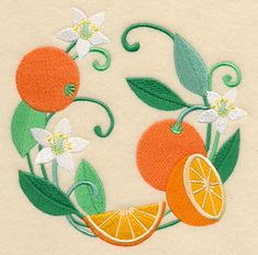 an embroidery design with oranges, flowers and leaves