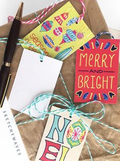 some christmas cards are tied up on a piece of brown paper with twine around them