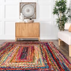 a living room area with a rug on the floor