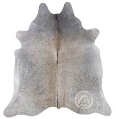 a white and gray cowhide rug on a white background