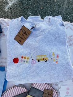 a t - shirt that says happy birthday on it and some other items next to it