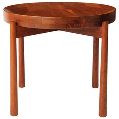 a wooden table with two legs and a circular top on it's side, against a white background