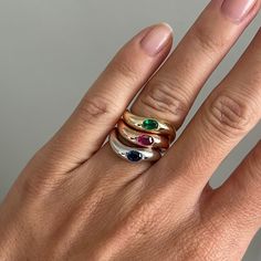 The Curved Gemstone Tri-Stacking Ring is a vibrant and stylish accessory that features three beautifully crafted rings, each adorned with a stunning emerald, sapphire, and ruby. Designed to curve elegantly around your finger, this unique stacking ring allows you to showcase the rich colors of the gemstones in three 14K gold colors. Available in 14k Yellow Gold, White Gold and Rose Gold Total Carat Weight: 0.20 ct Natural, untreated gemstones Sold as a set of three Made to order. Lead time is 6-8 weeks. Benefits of Solid 14k Jewelry Most loved for its durability and longevity Can be worn daily and requires less maintenance and care than plated, vermeil, or silver jewelry Sweat/water resistant so you can take your beloved pieces with you no matter the occasion Will not tarnish and become bro Custom Wedding Rings, Gold Colors, Tennis Necklace, Station Necklace, Custom Engagement Ring, Rich Colors, Stacking Ring, 8 Weeks, Signet Ring