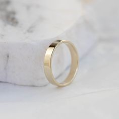 Mens Gold Ring, Mens Wedding Band, Men Wedding Band, Simple Wedding Band, Gold Wedding Band, Stacking Gold Ring, His and Hers, Flat Wedding Band A classic ring made of 14k solid gold with softened edges for comfort. Engrave the ring with no extra cost. High polished wedding band. 100% handcrafted with love! D E T A I L S ● Metal: 14K Solid Gold, 14K White Gold, 14K Rose Gold ● Finish: High polished or matte ● Dimensions: measures 3.7 mm in width x 1.2mm thick R I N G ∙ S I Z I N G For General Re Wedding Thick Band Ring In 14k Gold, 14k Gold Thick Band For Wedding, 14k Gold Wedding Band With Thick Shape, Polished Finish Wedding Rings With Thick Band, Yellow Gold Thick Band Couple Rings For Wedding, Yellow Gold Thick Band Wedding Couple Rings, Classic Thick Band Couple Rings For Wedding, Classic Couple Rings Stamped 14k For Wedding, Classic 14k Stamped Couple Rings For Wedding