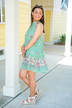 The Shelly Dress is perfect for a beach vacation or dinner by the ocean! This mini dress features a relaxed fit, sleeveless design, mock neckline with a self tie at the back, and a playful back cutout. The dress showcases a green hue with a beachy print of shells, starfish, and coral. Pair with our sunglasses and some sandals for a chic look! It is lightweight, fully lined, and fits true to size. 100% Polyester Brand- Olivaceous Model is 5'5" and is wearing a small Casual Green Dress For Beach Cover-up, Green Mini Dress For Summer, Green Sleeveless Mini Dress For Summer, Green Bohemian Sleeveless Beach Dress, Green Sleeveless Beach Dress For Beach Season, Green Sleeveless Beachwear Dress For Vacation, Green Mini Sleeveless Dress For Summer, Green Sleeveless Dress For Beach Vacation, Green Sleeveless Dress For Beach