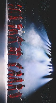 a group of people standing on top of a stage