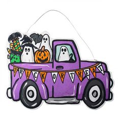 a purple truck with halloween decorations in the back