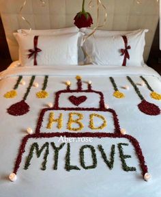 a bed with flowers and decorations on it