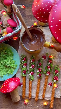 an assortment of food items on a table with mushrooms, grass and other things to make them look like they're eating