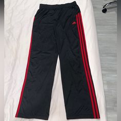 Has Pockets Colors: Black And Red Size: Xl Condition: New Without Tags Red Adidas Athleisure Pants, Adidas Red Cotton Pants, Casual Red Pants With Three Stripes, Adidas Black Sporty Pants, Black Adidas Cotton Sweatpants, Black Cotton Adidas Sweatpants, Adidas Black Sweatpants For Sports, Adidas Black Sportswear Sweatpants, Adidas Black Cotton Sweatpants