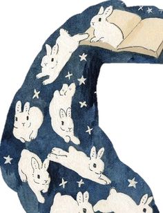 a book with rabbits on it and an open book in the shape of a letter