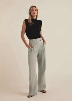 With an elongated and intensified silhouette, The Nadine Pant features front pleats, a high waist, back welt pockets and convenient side pockets. It's crafted from Ultimate Gray stretch-twill suiting fabric for a tailored fit that looks especially sharp when paired with The Nadine Blazer.63% Polyester, 32% Rayon, 5% Spandex Twill BlendMegan is 5'10" wearing size 2.Zak is 5'8" wearing size 4. Elegant Gray Wide Leg Workwear Pants, Chic Gray Pants For Workwear, Gray Wide Leg Pants With Belt Loops For Work, Chic Gray Pants For Work, Elegant Gray Wide Leg Pants For Work, Classic Gray Wide Leg Pants For Work, Chic Gray Wide Leg Pants For Work, Chic Gray Dress Pants For Workwear, Suiting Fabric