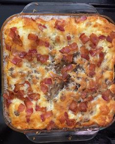 a casserole dish with meat and cheese in it on top of the stove