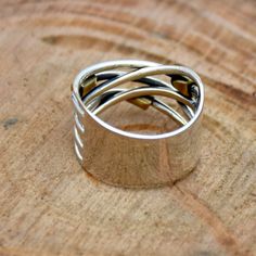 Handmade Wraparound Silver Wire ring, Sterling Silver Ring, Two Tone Ring, Silver wide wrap Ring, Multi Layer Silver Wire Ring, Gift For Her Height :13 MM Weight :6 to 10 Gm Metal : Sterling Silver Base Metal : 925 parts per 1000 Metal Purity : 925 parts per 1000 *SAjewellersStore is the desire and happiness for jewellery designers and makers. Beautiful, intricate and unique design jewellery making supplies. Each piece is a beauty to behold. Made with precious gemstones and set in silver and met Handmade Adjustable Wide Band Stackable Rings, Handmade Wide Band Ring For Promise, Handmade Wide Band Ring For Gift, Handmade Wide Band Ring Gift, Handmade Wide Band Stackable Rings As Gift, Unique Wide Band Promise Ring, Adjustable Wide Band Promise Ring, Unique Open Band Wide Ring As Gift, Handmade Wide Band Ring For Anniversary