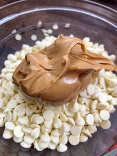 a bowl filled with beans and peanut butter on top of it's side,