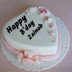 a heart shaped cake with the words happy b'day zinna on it