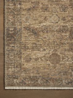 an area rug with brown and beige colors