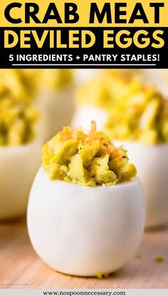 deviled eggs with crab meat in them and text overlay