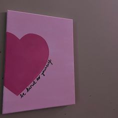 a pink canvas with a heart on it