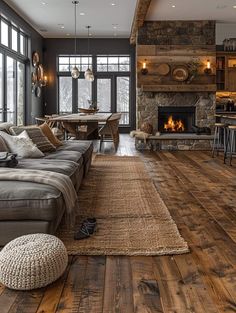 a living room filled with furniture and a fire place