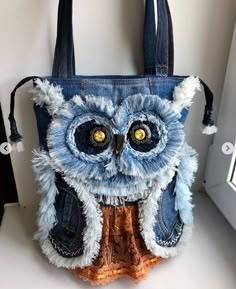 an owl purse is hanging on the wall