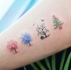 tattoos on the arm of a woman with trees and birds