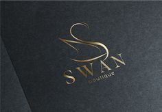 the swan boutique logo is shown on a black and gold paper with golden foil lettering