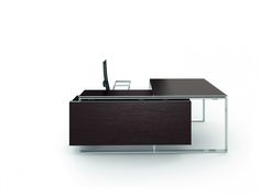 an office desk with a computer monitor and pen on it, in front of a white background