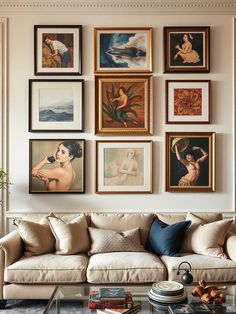 a living room filled with lots of pictures on the wall above a couch and coffee table