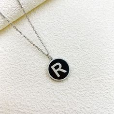 For the modern minimalist, our Alphabet Letter Round Black Initial Charm Necklace is a must-have accessory! This sleek and stylish necklace is available in both gold and silver, featuring a cute black and gold initial charm that adds a personalized touch to any outfit. Choose your favorite letter or stack multiple necklaces for a trendy accessory that's perfect for expressing yourself in style. Available in gold and silver. Multiple Necklaces, Initial Necklace Silver, Initial Necklace Gold, Stylish Necklace, Gold Initial, Initial Charm, Trendy Accessories, Initial Necklace, Cute Black