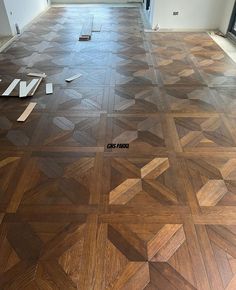 an empty room with wood flooring that has been stripped off and put in place