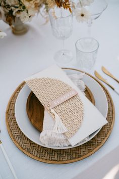 a table setting with place settings and napkins