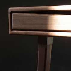 a close up of a wooden table with a light coming through the top and bottom