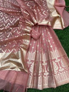 It's a beautiful lehenga set of chanderi material . The whole collection has beautiful pastel and few bright shades .  Lehenga - 5 Mtr Banarasi Matt zari lorex fabric. Blouse - 1 mtr lorex matt zari Dupatta - 2.5 mtr matt lorex fancy weaving  Dry clean only . Please note - color may be vary a little due to sunlight and photography . This is unstitched material only . Lehenga and blouse stitching is also available . Unstitched Cotton Silk Choli For Festivals, Festive Cotton Silk Lehenga With Zari Work, Festive Sheer Dupatta Cotton Silk Lehenga, Festive Semi-stitched Cotton Silk Lehenga, Semi-stitched Chanderi Lehenga With Gota Work, Unstitched Bollywood Lehenga In Cotton Silk, Festive Cotton Silk Lehenga With Cutdana Detail, Festive Cotton Silk Lehenga With Cutdana, Designer Cotton Silk Lehenga With Sheer Dupatta