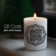 a white candle with a qr code on it