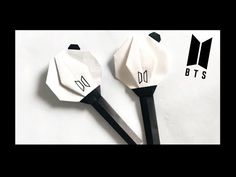 two black and white spatulas sitting on top of each other