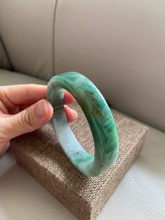 "🌈 Jade Bangle 59.8mm (2.35\"), Round Shape, Green & Light Green 🌷 Untreated Natural Jadeite/ Grade A Jade 🌷 Certified : Yes 🌷 Jade from Myanmar/ Burma 🌷 Shape : Round 🌷 Inner diameter : 59.8mm / 2.35\" 🌷 Width & Thickness : 13.5 x 8.5mm 🌷 Color : Green & Light Green 🌷 Free standard shipping from Hong Kong with tracking included 🌷 Take approximately 7-21 days to arrive worldwide ❤️ In Chinese Culture: Young people wear jade pendant will have a prosperous life, attracts good Green Carved Round Bangle, Carved Jade Round Bracelets, Carved Jade Bracelets, Green Carved Bangle Bracelets, Green Carved Bangle Bracelet, Elegant Carved Green Bangle, Elegant Green Carved Bangle, Carved Jade Bracelet, Luxury Green Gemstone Bangle