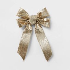 a gold bow on a white background