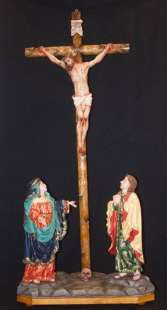 the crucifix is displayed with two people