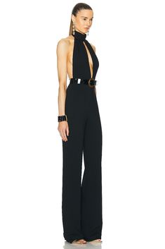 Find TOM FORD Stretch Sable Jumpsuit on Editorialist. TOM FORD Stretch Sable Jumpsuit in Black 97% viscose 3% elastane. Made in Italy. Dry clean only. Hidden back zipper closure. Attached waist belt with buckle closure. TFOF-WC3. TU0269-FAX1105. About the designer: Tom Ford lends a contemporary elegance to all things sartorial. Raised in Santa Fe, Ford made a name for himself as creative director at Gucci, where he transformed the house of fashion into a thriving 21st century brand before going on to launch his own wildly successful label in 2005. Today, Tom Ford is coveted for everything from its statement sunglasses and fine leather accessories to its glamorous dresses and impeccably tailored suits. A Tom Ford design is an exquisite balance of timelessness and modernity. Black Leather Jumpsuit, Black Halter Jumpsuit, Statement Sunglasses, Halter Neck Jumpsuit, Belt With Buckle, Black Toms, Leather Jumpsuit, Crepe Jumpsuit, Jersey Jumpsuit