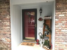 the front door is decorated with holiday decorations