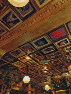 the ceiling is decorated with paintings and lights