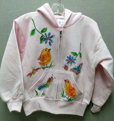 Cotton or cotton blend hooded sweatshirt with full zipper front. and pockets Individually hand painted with a design featuring cute chicks and fun flowers scattered around the front of the hoodie, with one on the back as well. white, light pink, ash gray. other colors subject to availability. Machine wash cold or warm. Line dry or tumble dry on low heat. Wear often and look cute Cute Hooded Sweatshirt For Spring, Cute Spring Hooded Sweatshirt, Cute Cotton Hoodie For Spring, Cute Cotton Spring Hoodie, Spring Cotton Hooded Jacket, Cute Spring Sweatshirt With Drawstring Hood, Playful Sweatshirt With Drawstring Hood For Spring, Pink Hoodie Jacket For Spring, Pink Hooded Jacket For Spring