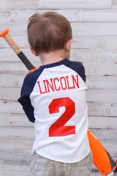 This is a personalized 2nd birthday baseball shirt for your sports themed party! This shirt is made to order we can customize the numbers and your child's name! The navy/white raglan pictured is 3/4 length sleeves. Adult sizes available as well for matching shirts! Please check the size chart these run a little smaller Matching Hats can be found here: https://www.etsy.com/listing/485289159/baseball-birthday-hat-boys-birthday-hat ⚾️Family shirts⚾️ https://etsy.me/2ThDfqX **Please check shop annou Team-colored Baseball Jersey With Name Print, Baseball Jersey With Name Print For Baseball Season, Baseball Jersey With Name Print For Game Day, Game Day Sports Fan Baseball Jersey With Name Print, White Baseball Jersey With Name Print For Game Day, School Spirit Baseball Jersey With Team Name, Team-colored Baseball Jersey For School Spirit, School Spirit Team-colored Baseball Jersey, Game Day Baseball Jersey With Name Print