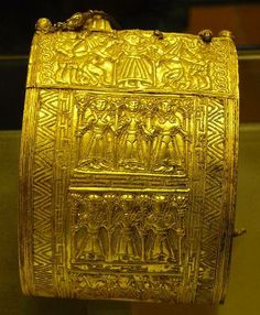 an ornate gold box is on display in a museum