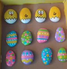 an assortment of decorated eggs in a box