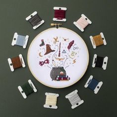 a cross stitch pattern with various sewing pins arranged in the shape of an embroidery circle