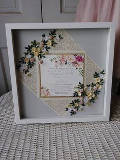 a white frame with flowers on it and a poem in the center that reads,