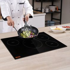 a person in a chef's outfit cooking food on a stove top with a frying pan