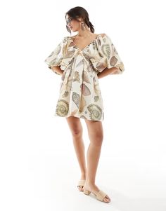 ASOS DESIGN ultimate puffed sleeve v-neck mini smock dress in shell print | ASOS Printed Beige Mini Dress, Beige V-neck Mini Dress For Beachwear, Vacation Mini Dress With Gathered Short Sleeves, Summer Brunch V-neck Dress With Gathered Sleeves, Printed Puff Sleeve Vacation Dresses, Printed Puff Sleeve Dress For Vacation, Vacation Printed Puff Sleeve Dresses, Vacation Puff Sleeve Printed Dresses, Summer Beach Mini Dress With Gathered Sleeves